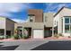 View of the modern house with a two car garage at 649 Tranquil Jade St, Las Vegas, NV 89138