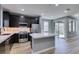 Modern kitchen with stainless appliances and center island with light, modern flooring at 649 Tranquil Jade St, Las Vegas, NV 89138