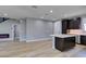 The modern kitchen boasts stainless appliances, kitchen island, and sleek cabinetry at 649 Tranquil Jade St, Las Vegas, NV 89138