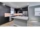 Modern kitchen featuring stainless appliances, a center island, and dark cabinetry at 649 Tranquil Jade St, Las Vegas, NV 89138
