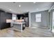 Modern kitchen features an island, sleek cabinetry, stainless appliances, and contemporary finishes at 649 Tranquil Jade St, Las Vegas, NV 89138