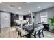 Modern kitchen with stainless steel appliances and a dining table at 649 Tranquil Jade St, Las Vegas, NV 89138