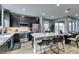 Modern kitchen featuring dark wood cabinets, stainless steel appliances, and an island with seating at 649 Tranquil Jade St, Las Vegas, NV 89138