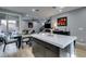 Open concept kitchen featuring a large island with a white countertop and dark wood cabinets at 649 Tranquil Jade St, Las Vegas, NV 89138