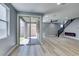 Modern living space with sliding glass doors to outdoor area and contemporary staircase at 649 Tranquil Jade St, Las Vegas, NV 89138