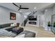 Modern living room featuring a gray sectional, sleek fireplace, and stylish decor at 649 Tranquil Jade St, Las Vegas, NV 89138