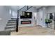 Bright living room features a staircase, fireplace and neutral decor at 649 Tranquil Jade St, Las Vegas, NV 89138