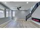 Well-lit living area featuring modern staircase, contemporary fireplace, and open floor plan at 649 Tranquil Jade St, Las Vegas, NV 89138