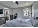 Bright main bedroom featuring a large bed, dresser, ample natural light, and ensuite access at 649 Tranquil Jade St, Las Vegas, NV 89138