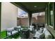 Relaxing patio with modern furniture, built-in grill and cozy fire pit area for outdoor entertainment at 649 Tranquil Jade St, Las Vegas, NV 89138