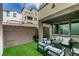 View of the landscaped backyard with a covered patio, grill and outdoor seating area, perfect for gatherings at 649 Tranquil Jade St, Las Vegas, NV 89138