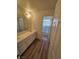 Bathroom featuring a double vanity and a shower at 6529 Bradford Ln, Las Vegas, NV 89108