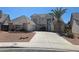 Charming two-story home with a well-manicured lawn and a spacious driveway at 6529 Bradford Ln, Las Vegas, NV 89108