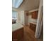 Open-concept kitchen featuring oak cabinets, laminate counters and flooring and a walk-in pantry at 6529 Bradford Ln, Las Vegas, NV 89108