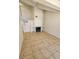 Bright living room featuring neutral walls, tile floors, and fireplace at 6529 Bradford Ln, Las Vegas, NV 89108