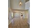 Bright living room featuring neutral walls, tile floors, and bright lighting at 6529 Bradford Ln, Las Vegas, NV 89108