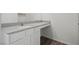 Bathroom vanity featuring a light countertop and white cabinets at 6772 Violet Cascade Ave, Las Vegas, NV 89156