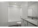 Bathroom with vanity and granite countertop next to tub and shower combo at 6772 Violet Cascade Ave, Las Vegas, NV 89156