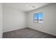 Bedroom with carpeted floors and a window letting in bright, natural light at 6772 Violet Cascade Ave, Las Vegas, NV 89156