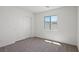 Clean bedroom featuring carpet floors and a closet with sliding doors at 6772 Violet Cascade Ave, Las Vegas, NV 89156