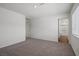 Large, carpeted bedroom with a closet and ensuite bathroom entrance at 6772 Violet Cascade Ave, Las Vegas, NV 89156