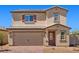 Charming two-story home featuring a brick driveway, neutral colors, and a convenient two-car garage at 6772 Violet Cascade Ave, Las Vegas, NV 89156