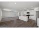 The kitchen features stainless steel appliances, white cabinetry, and an open-concept design at 6772 Violet Cascade Ave, Las Vegas, NV 89156