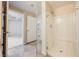 Bright bathroom features a glass enclosed shower with tiled floors and white shower stall at 6868 Sky Pointe Dr # 1112, Las Vegas, NV 89131