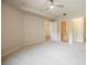 The bedroom offers carpeting, a ceiling fan, and multiple doors to other spaces at 6868 Sky Pointe Dr # 1112, Las Vegas, NV 89131