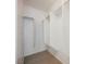 This walk-in closet offers ample storage space with built-in shelving and neutral carpeting at 6868 Sky Pointe Dr # 1112, Las Vegas, NV 89131