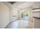 Bright dining area with access to a balcony and an adjacent updated kitchen at 6868 Sky Pointe Dr # 1112, Las Vegas, NV 89131