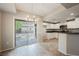 This bright kitchen boasts stainless steel appliances and white cabinets with outdoor access at 6868 Sky Pointe Dr # 1112, Las Vegas, NV 89131