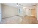 Neutral living room offers ample space with an open doorway and neutral color palette at 6868 Sky Pointe Dr # 1112, Las Vegas, NV 89131