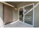 A cozy patio with stucco walls and a sliding glass door that offers indoor/outdoor living at 6868 Sky Pointe Dr # 1112, Las Vegas, NV 89131