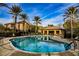 Enjoy this community pool with lounge area and lush landscaping and palm trees at 6868 Sky Pointe Dr # 1112, Las Vegas, NV 89131