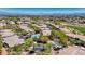 Panoramic aerial view of a residential community with a pool and desert landscaping at 701 Peachy Canyon Cir # 201, Las Vegas, NV 89144