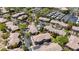 Overhead view of Summerlin townhomes featuring mature landscaping, parking, and a community swimming pool at 701 Peachy Canyon Cir # 201, Las Vegas, NV 89144