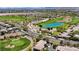 Aerial view of a Summerlin neighborhood with a golf course, pond, and roadway at 701 Peachy Canyon Cir # 201, Las Vegas, NV 89144