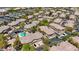 Aerial image of townhomes with a community pool, surrounded by trees and parking in Summerlin at 701 Peachy Canyon Cir # 201, Las Vegas, NV 89144