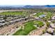 Aerial view of neighborhood with golf course, pond and desert landscape in Summerlin, Las Vegas at 701 Peachy Canyon Cir # 201, Las Vegas, NV 89144