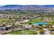 Picturesque aerial view of community near a golf course with a pond at 701 Peachy Canyon Cir # 201, Las Vegas, NV 89144