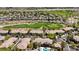 Aerial view of a residential area with golf course, lush vegetation, and roadways at 701 Peachy Canyon Cir # 201, Las Vegas, NV 89144