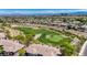 Sweeping aerial view showcasing a residential area next to a golf course at 701 Peachy Canyon Cir # 201, Las Vegas, NV 89144
