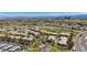 Expansive aerial view of a residential community with a golf course and mountain views at 701 Peachy Canyon Cir # 201, Las Vegas, NV 89144