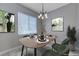 Modern dining room with stylish light fixture and a dining table set for four at 701 Peachy Canyon Cir # 201, Las Vegas, NV 89144