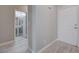 Welcoming entryway with white front door leading to a bathroom featuring a pedestal sink at 701 Peachy Canyon Cir # 201, Las Vegas, NV 89144