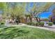 Condo exterior showing lush landscaping and manicured lawns at 701 Peachy Canyon Cir # 201, Las Vegas, NV 89144