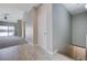 Hallway with a closet, showcases access to the living room, blending practicality with a modern aesthetic at 701 Peachy Canyon Cir # 201, Las Vegas, NV 89144