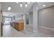 Spacious kitchen with an island and stainless steel appliances opening into a living area at 701 Peachy Canyon Cir # 201, Las Vegas, NV 89144