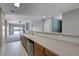 Spacious kitchen with stainless steel dishwasher and sink, view to living space at 701 Peachy Canyon Cir # 201, Las Vegas, NV 89144
